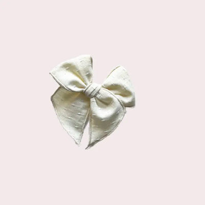 Cream cross stitch bow