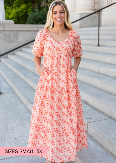 Peach floral tiered dress with pockets and v-neck