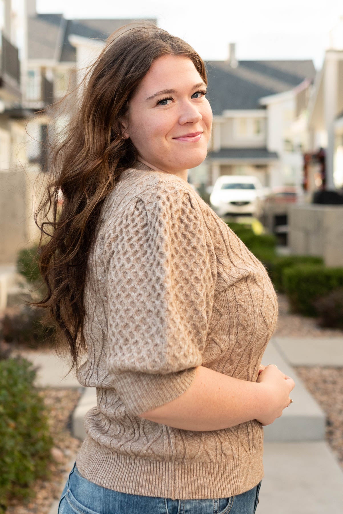 Side view of the plus size taupe short sleeve sweater