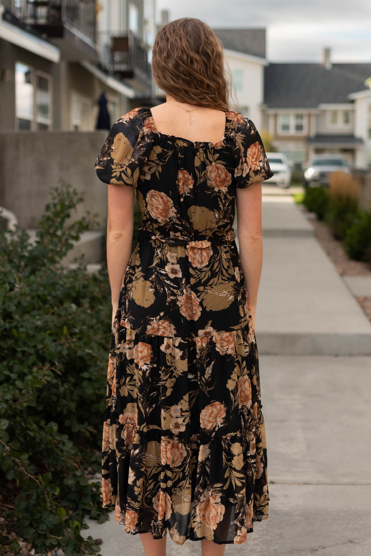 Back view of a black floral dress