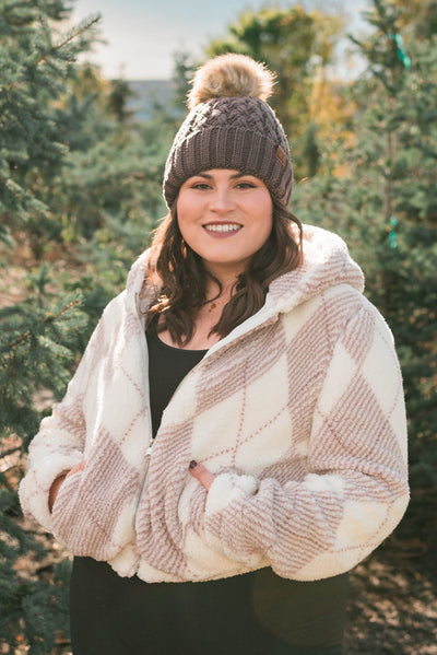 Brown C.C beanie with a pompom on top