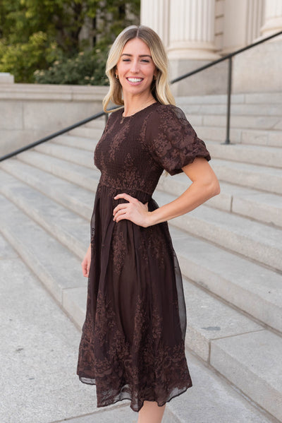 Side view of the brown embroidered dress