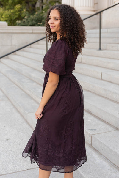 Side view of the plum embroidered dress