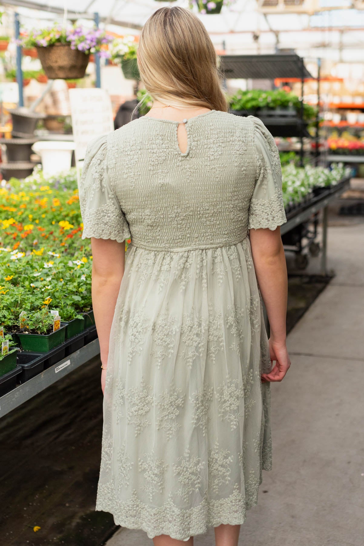 Back view of the sage embroidered dress