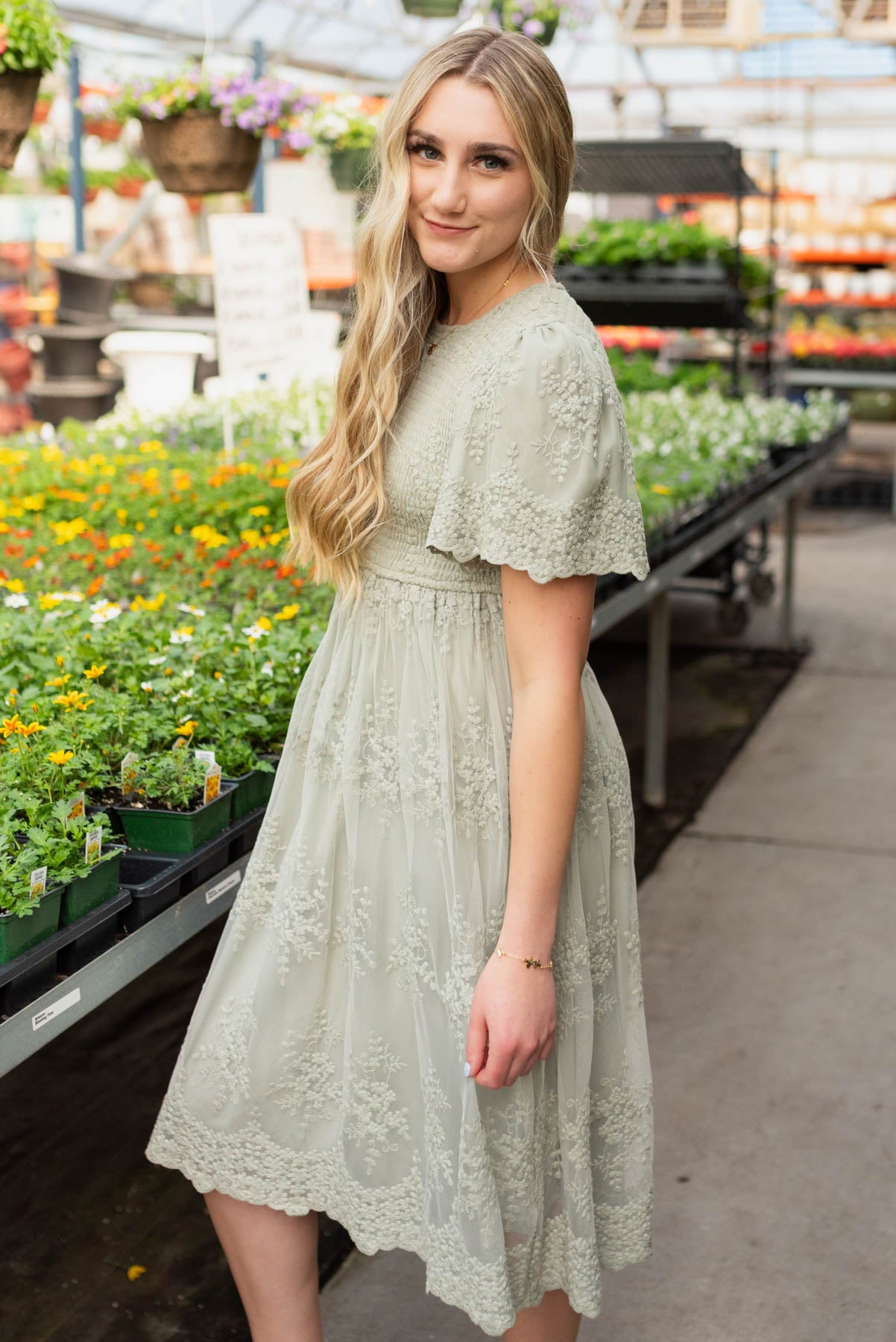 Side view of the sage embroidered dress