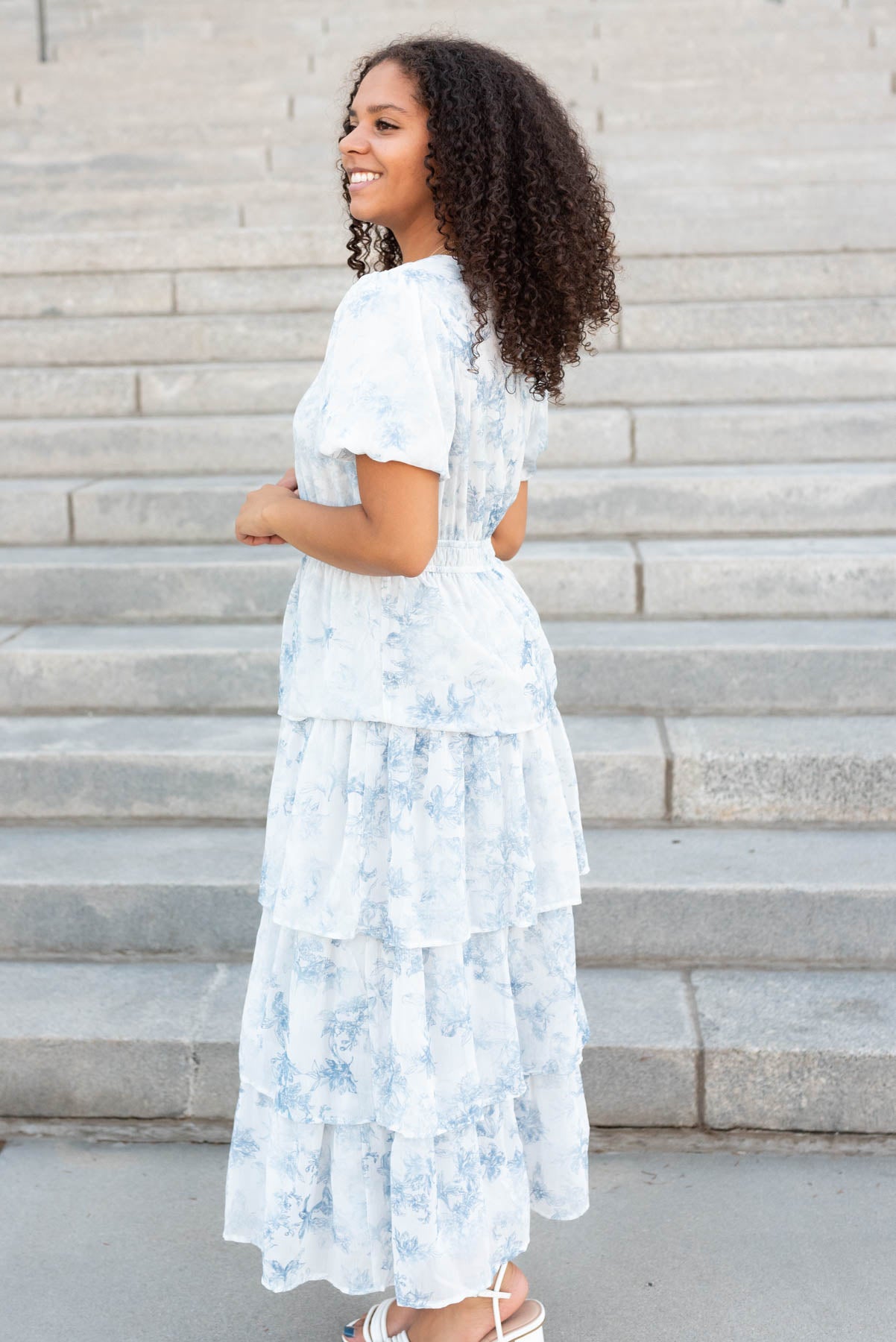 Side view of the light grey floral ruffle dress