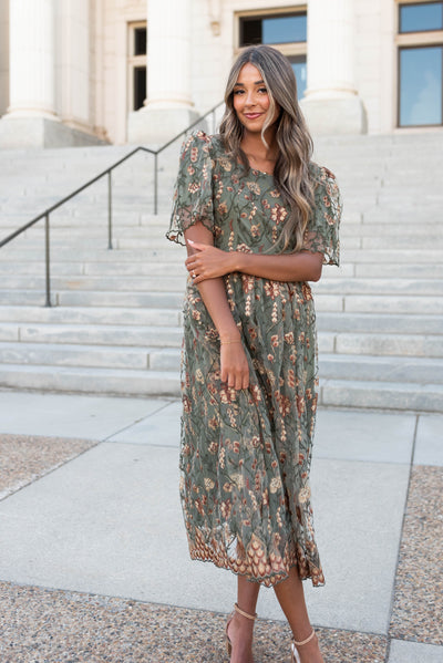 Front view of the small olive embroidered dress