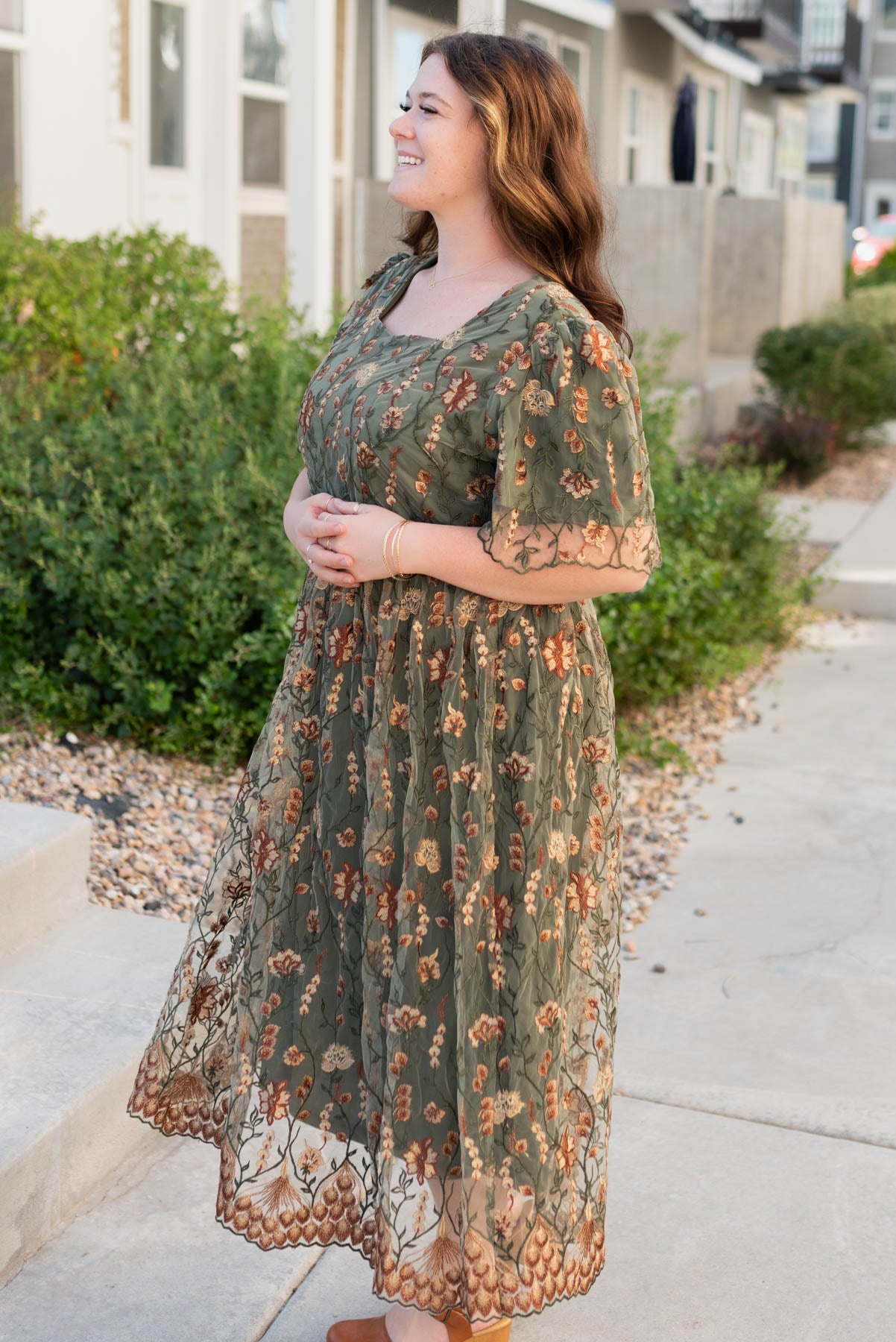 Side view of the olive embroidered dress in plus size