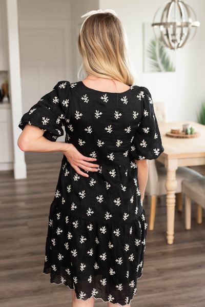 Back view of the black embroidered dress