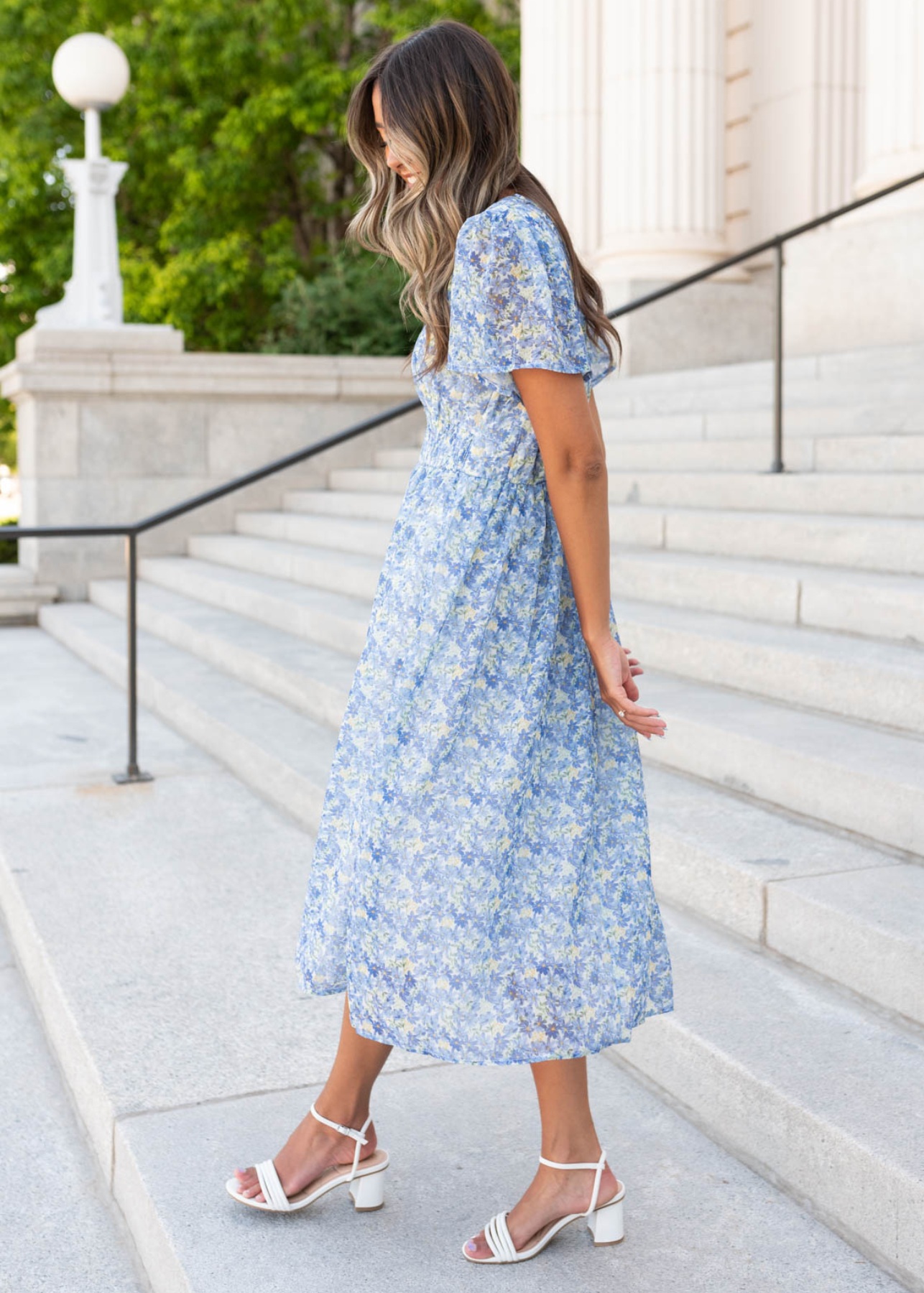 Short sleeve side view of the blue floral dress