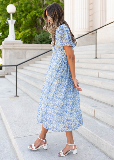 Short sleeve side view of the blue floral dress