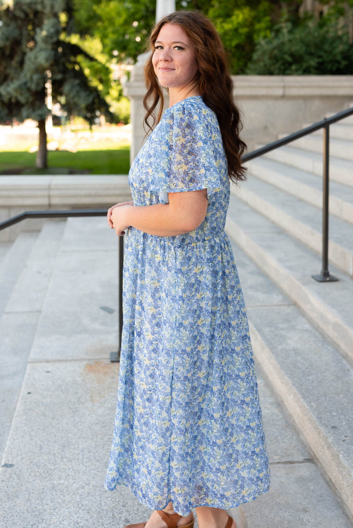 Side view of the plus size blue floral dress