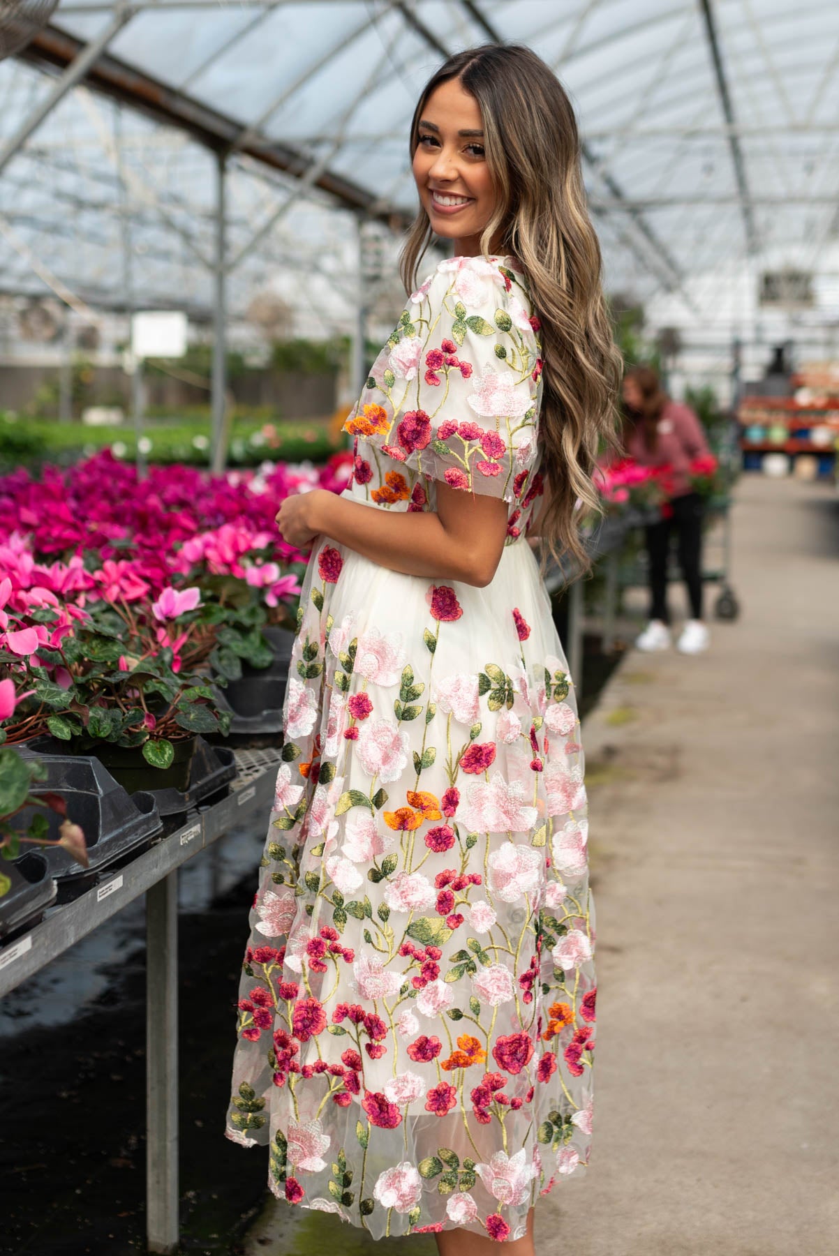 Side view of the magenta floral embroidered mesh dress