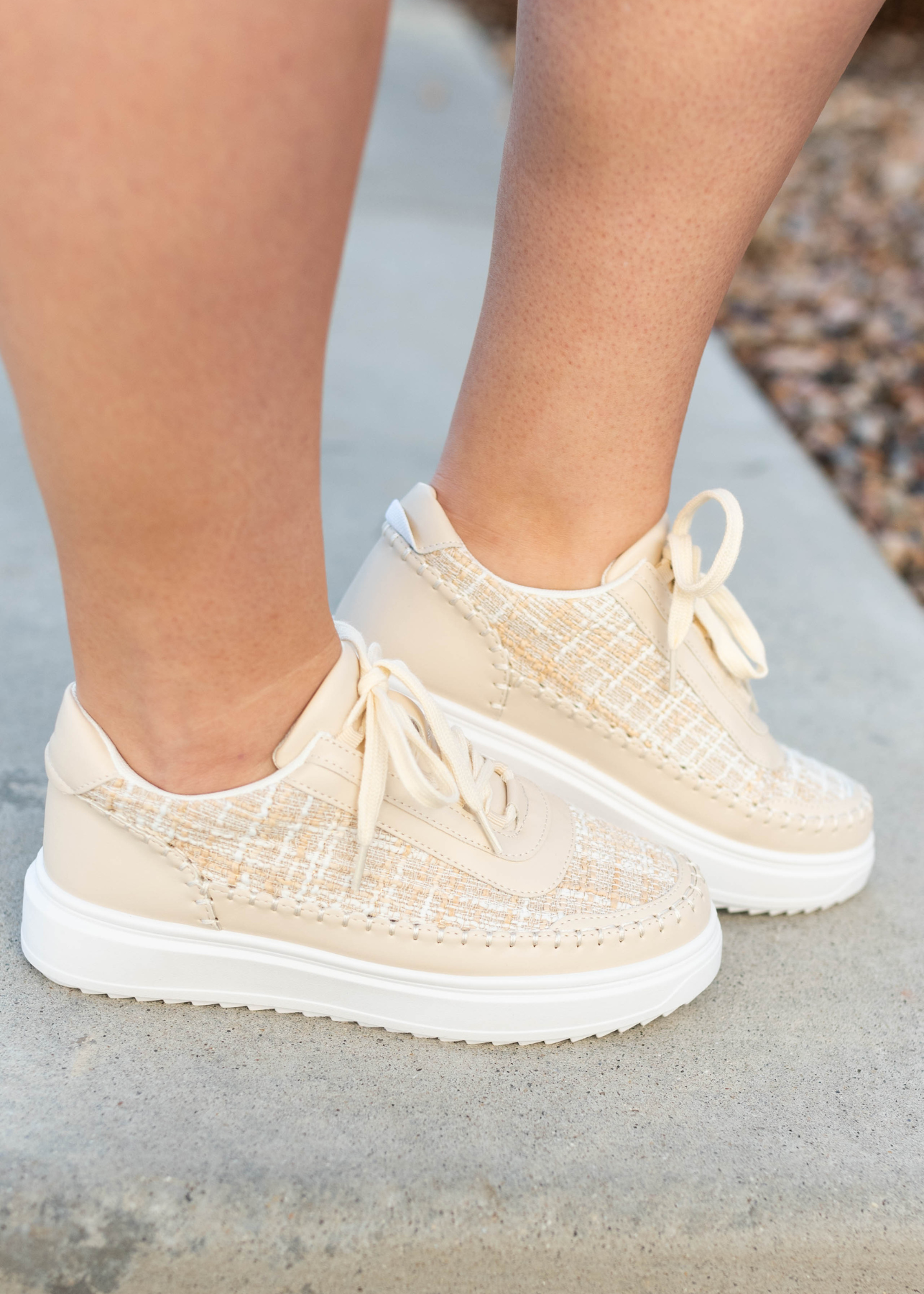 Side view of the beige tweed sneakers