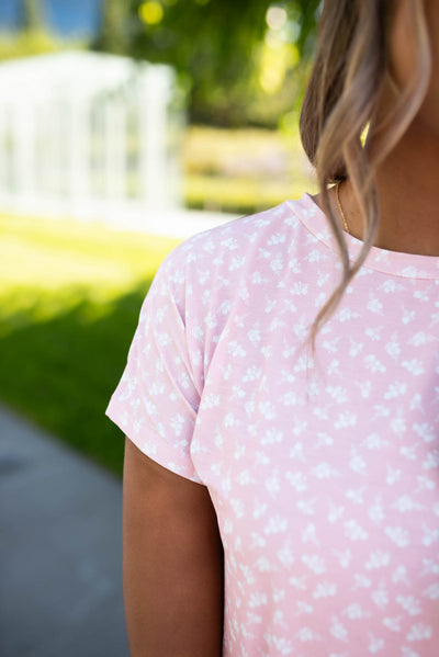 Close up of the pink floral top sleeve and fabric