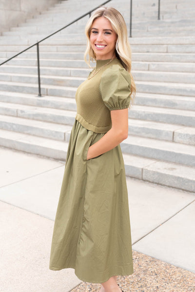 Side view of the olive knit bodice dress