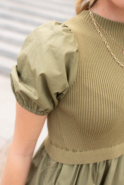 Close up of the bodice on the olive knit bodice dress