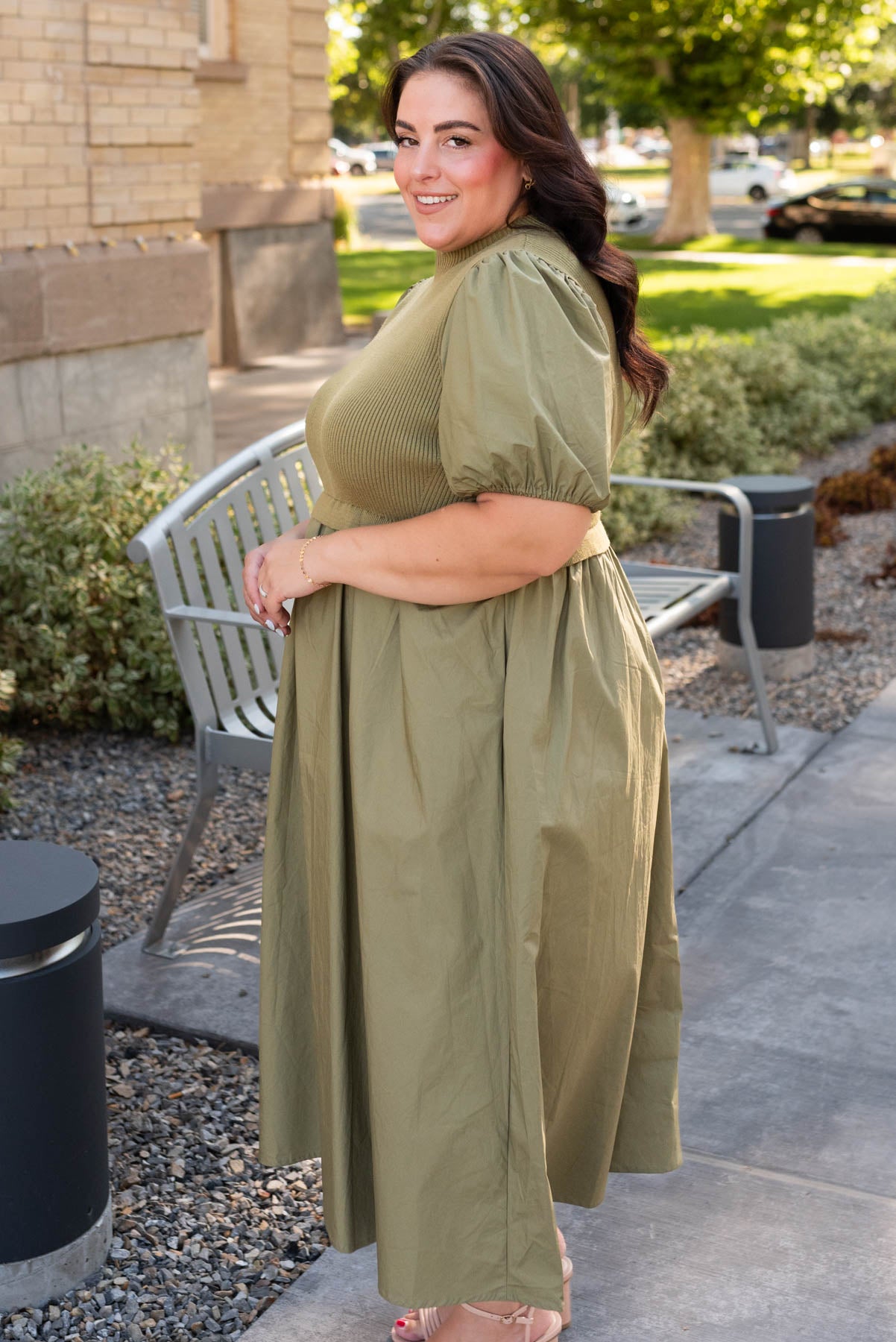 Side view of the plus size olive knit bodice dress