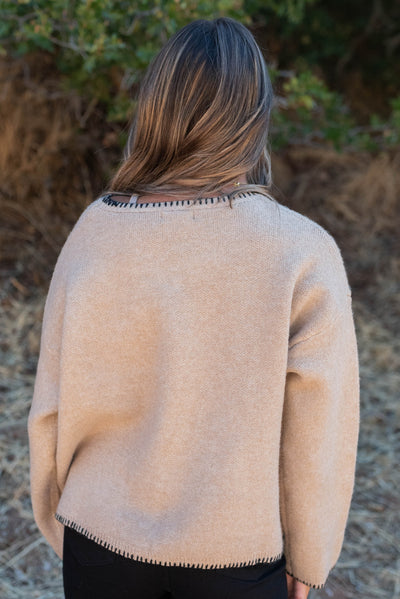 Back view of the taupe stitch pocket sweaters