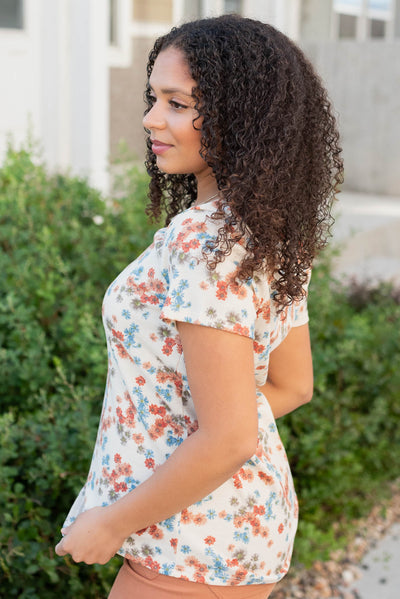 Side view of the cream floral top