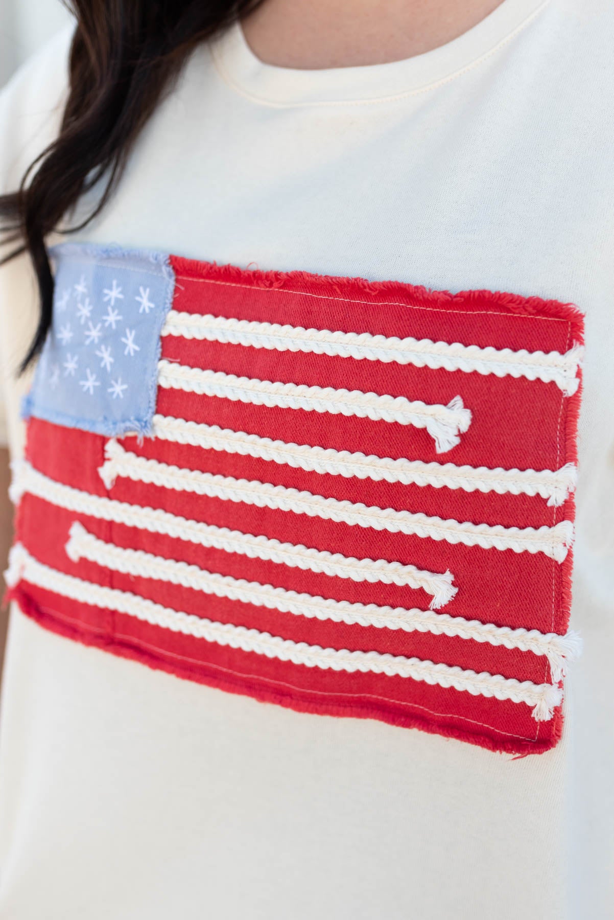 Close up of the flag on the ivory American flag patch top