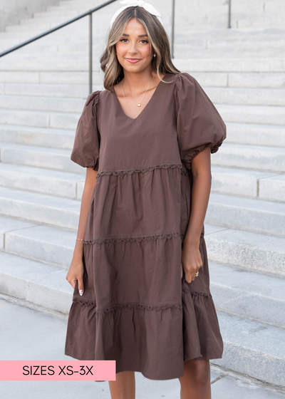 V-neck brown tiered dress with short puff sleeves
