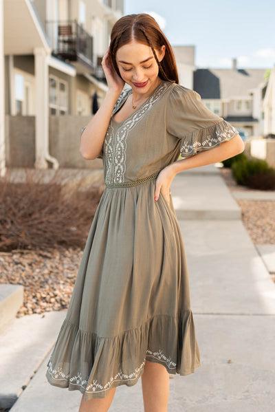 Side view of the sage embroidered dress