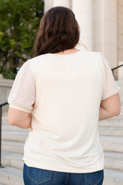 Back view of the egg shell dot puff sleeve top in plus size