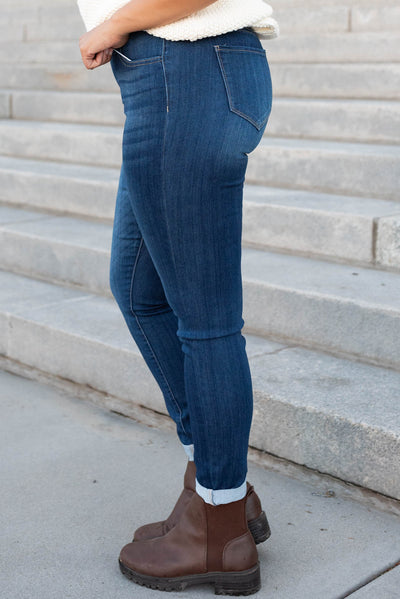 Side view of the dark mid rise jeans