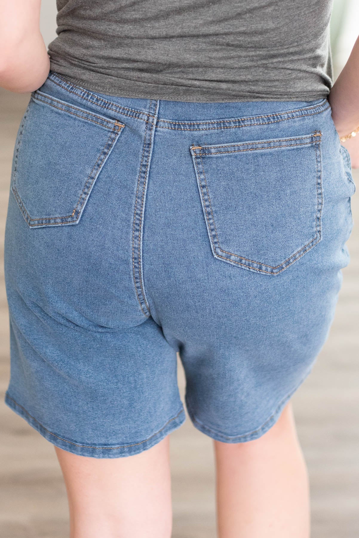 Back view of the denim Bermuda shorts