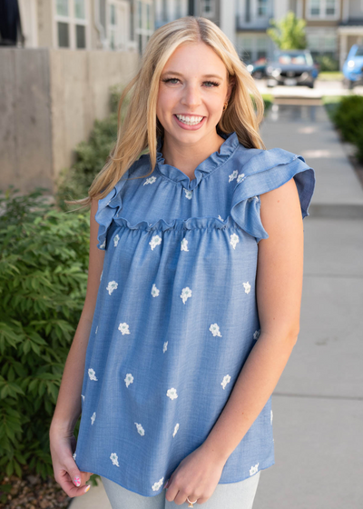 Front view of the denim blue floral top