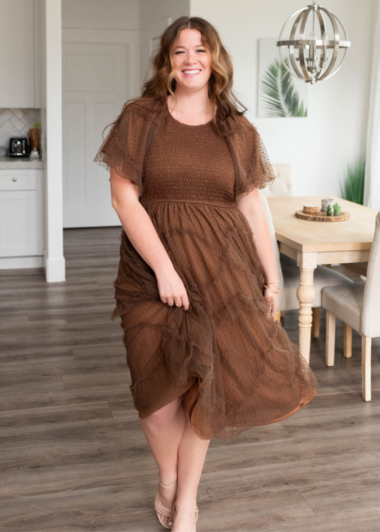 Plus size brown smocked ruffle dress with ruffles on the skirt and sleeves