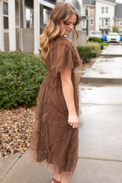 Side view of the brown smocked ruffle dress