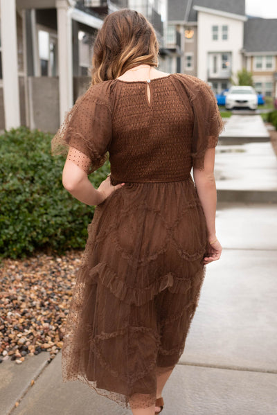 Back view of the brown smocked ruffle dress