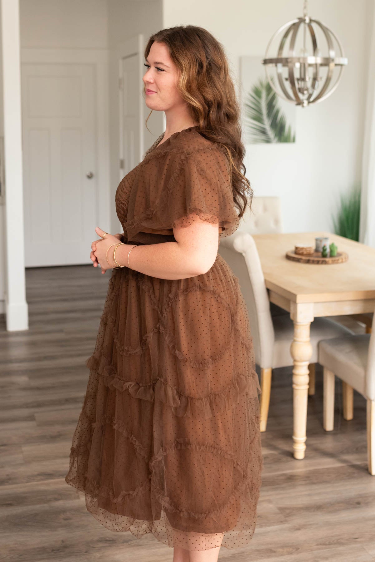 Side view of the brown smocked ruffle dress