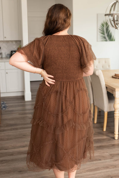 Back view of the brown smocked ruffle dress