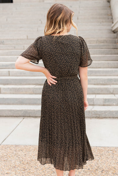 Back view of the black pleated dress