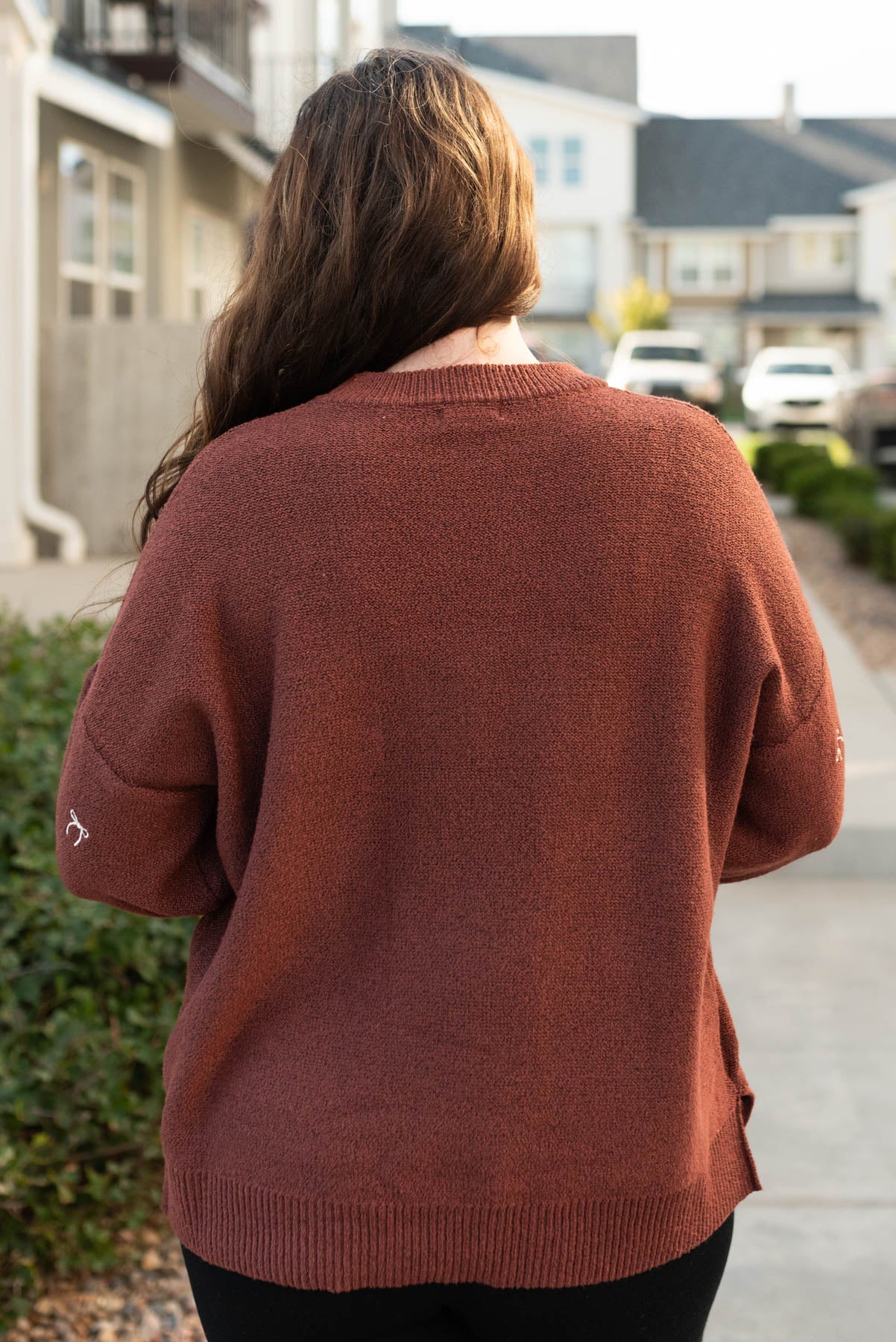 Back view of the sienna bow sweater in plus size