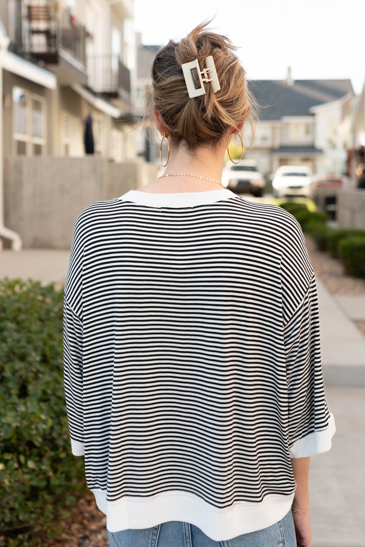 Back view of the black stirpe top