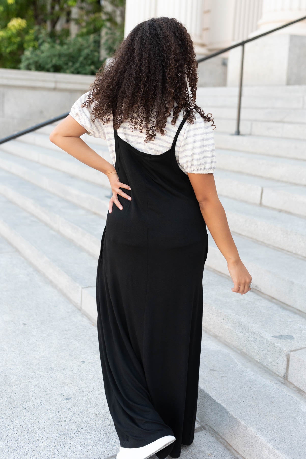 Back view of the black overall maxi dress