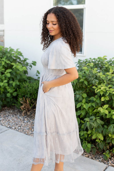 Side view of the grey floral lace dress