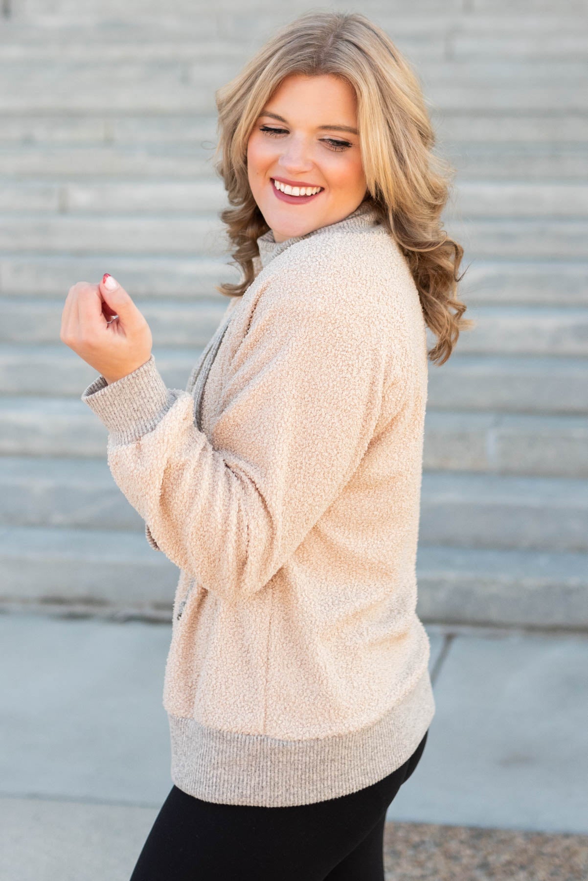 Side view of the fuzzy ivory pullover