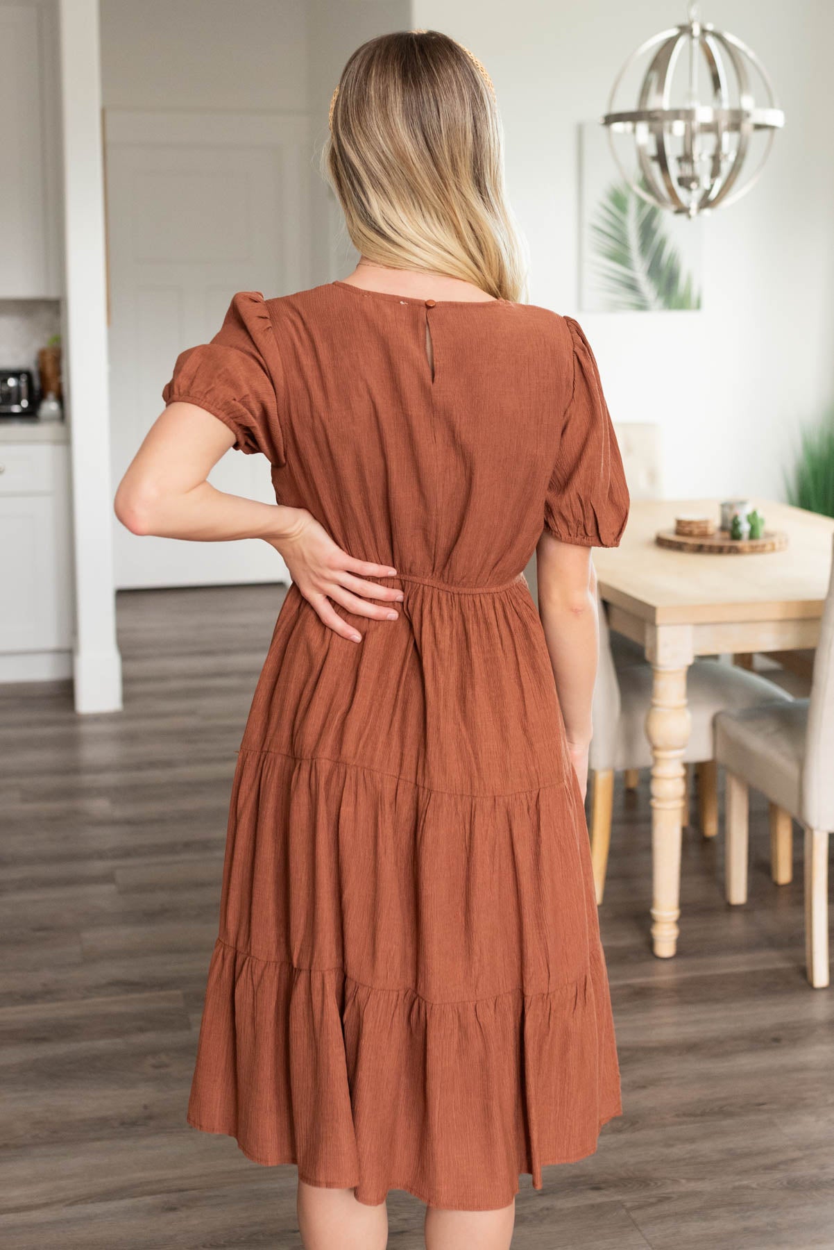 Back view of the rust embroidered dress