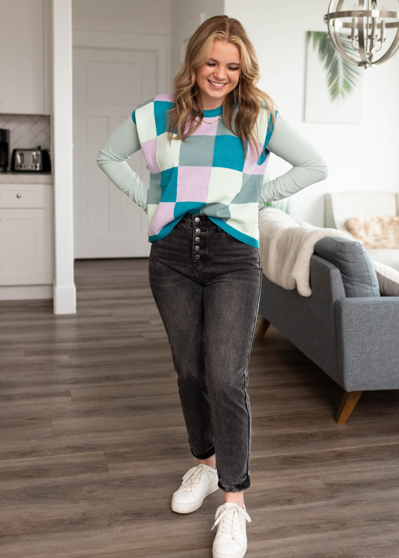 Front view of the teal checkered sweater vest