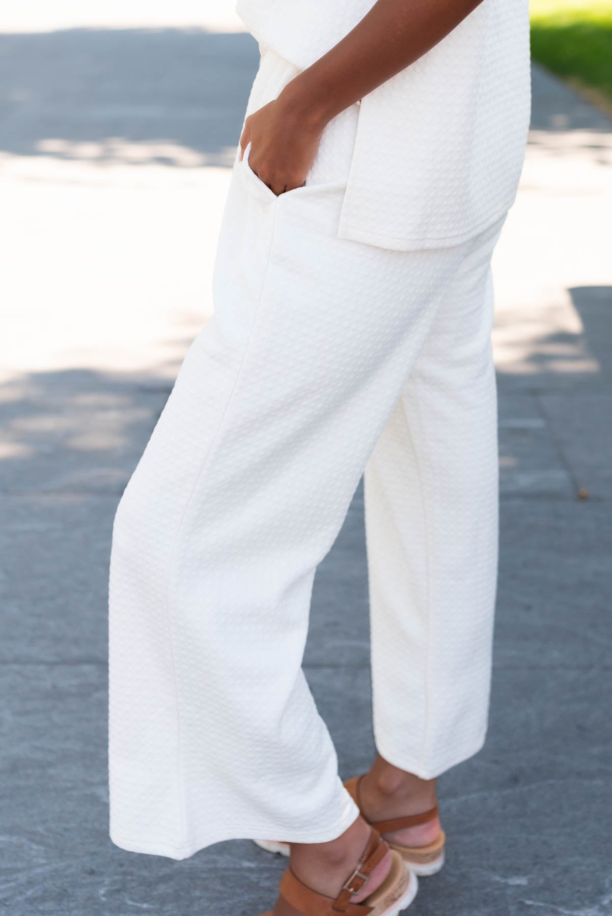 Side view of the ivory knit pattern pants