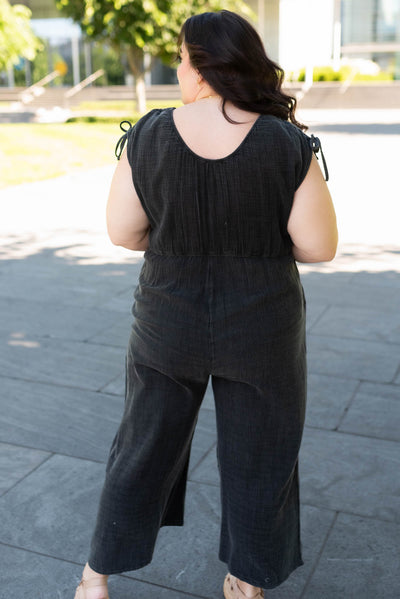 Back view of the the plus size black mineral wash jumpsuit