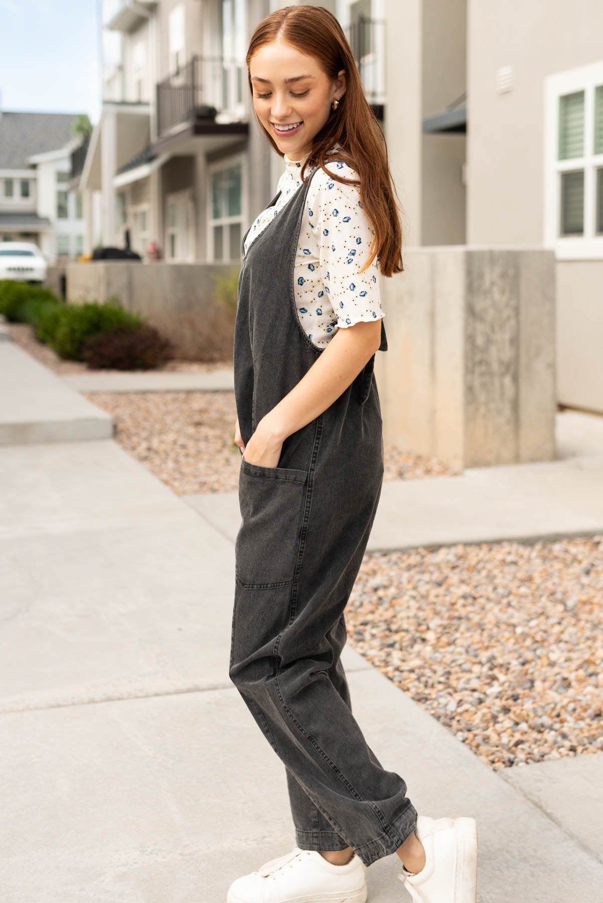 Side view of the charcoal washed jumpsuit