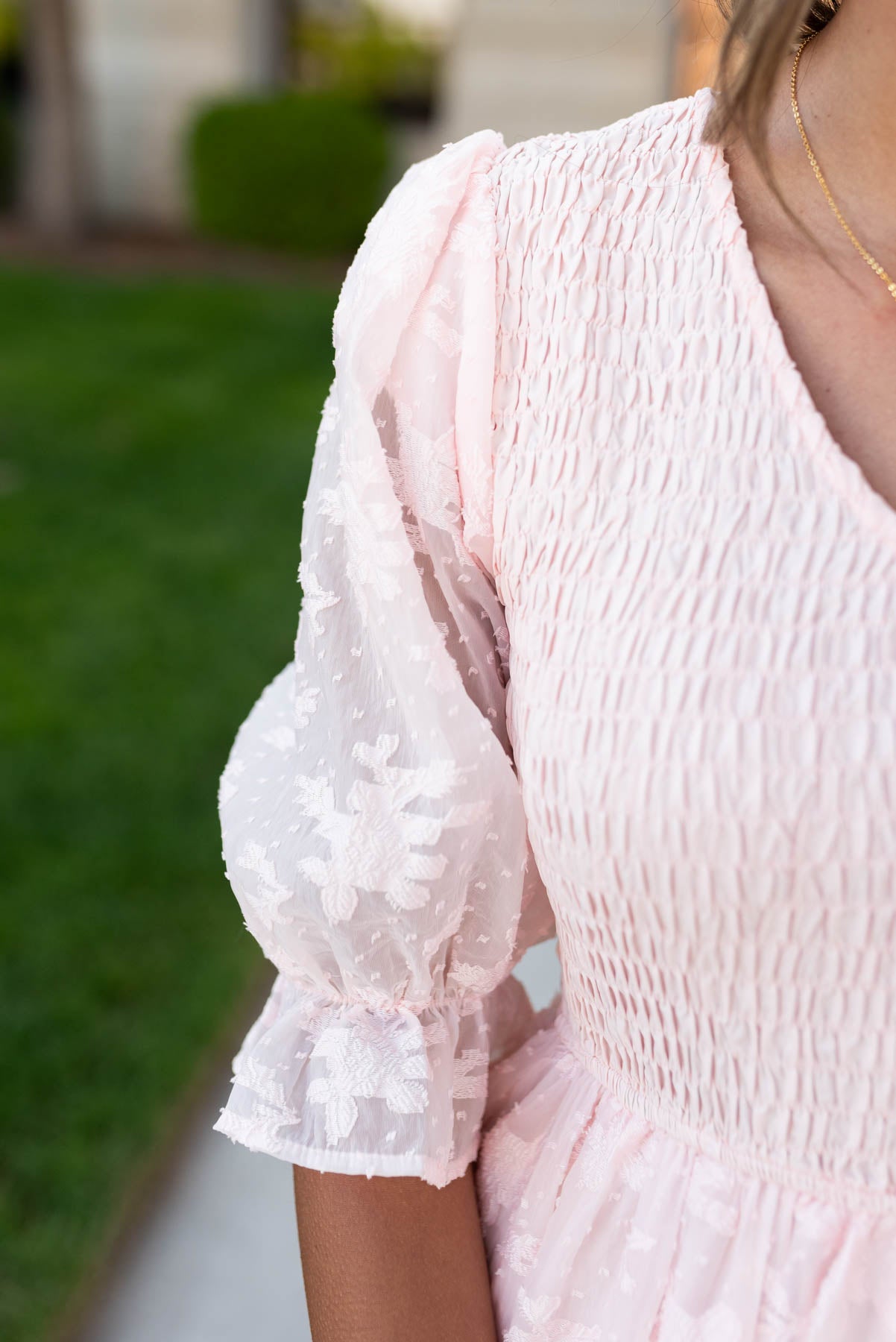 Close up of the sleeve and fabric on the plus size blush v-neck maxi dress