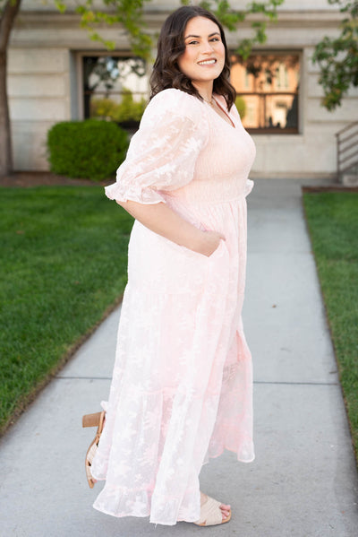 Side view of the plus size blush v-neck maxi dress