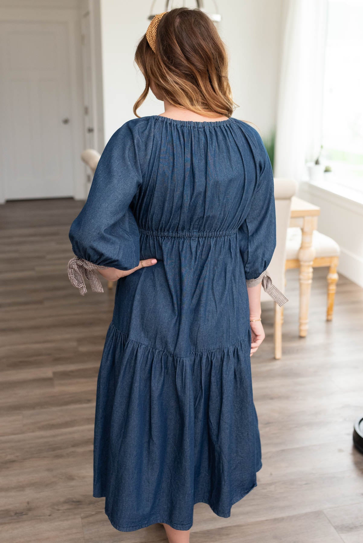 Back view of the dark denim tiere dress